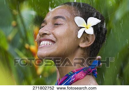 Close-up of a teenage girl enjoying rain shower View Large Photo Image Stock Image - Close-up of a teenage girl enjoying rain shower. Fotosearch