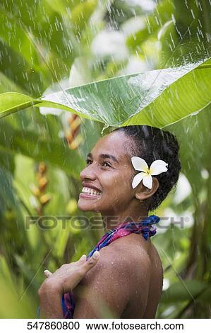 Close-up of a teenage girl enjoying rain shower View Large Photo Image Stock Image - Close-up of a teenage girl enjoying rain shower. Fotosearch