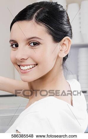 Stock Photo - Close-up of a teenage girl smiling. Fotosearch