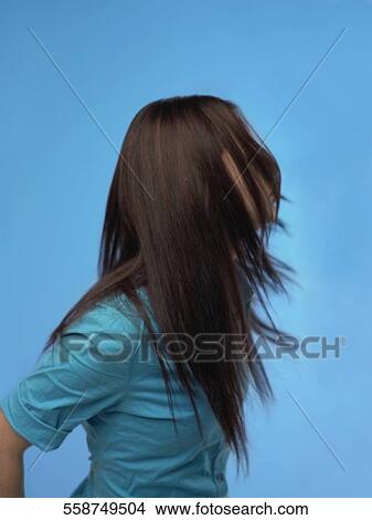 Picture - Close-up of a teenage girl with tousled hair. Fotosearch