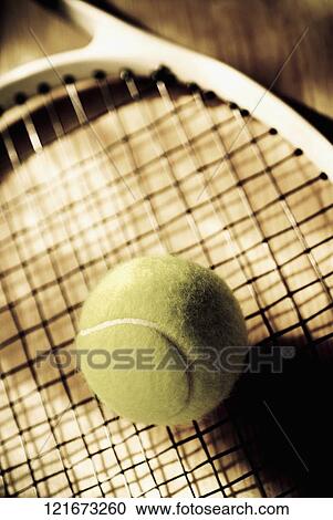 Close-up of a tennis ball and a tennis racket View Large Photo Image Stock Image - Close-up of a tennis ball and a tennis racket. Fotosearch