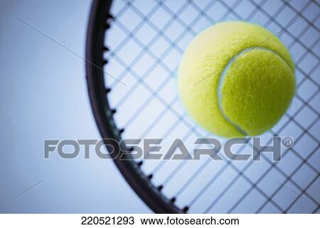 Close-up of a tennis ball and a tennis racket View Large Photo Image Stock Image - Close-up of a tennis ball and a tennis racket. Fotosearch