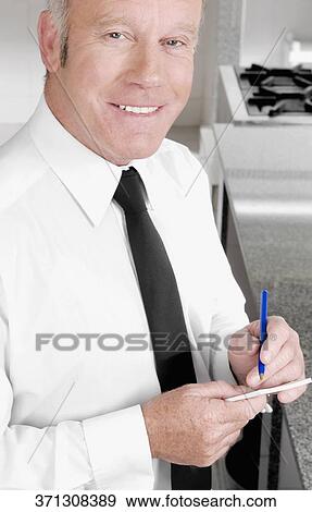 Stock Photo - Close-up of a waiter taking orders. Fotosearch