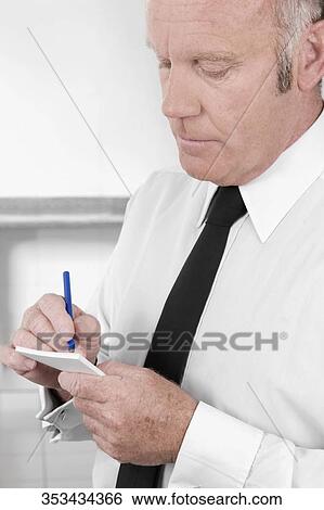 Close-up of a waiter taking orders View Large Photo Image Stock Photograph - Close-up of a waiter taking orders. Fotosearch