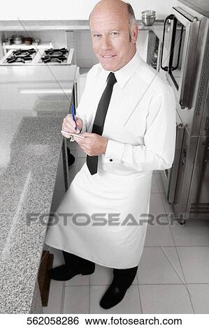 Close-up of a waiter taking orders View Large Photo Image Stock Photograph - Close-up of a waiter taking orders. Fotosearch