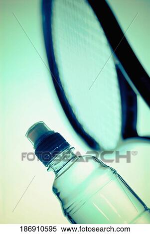 Close-up of a water bottle and a tennis racket View Large Photo Image Stock Photography - Close-up of a water bottle and a tennis racket. Fotosearch