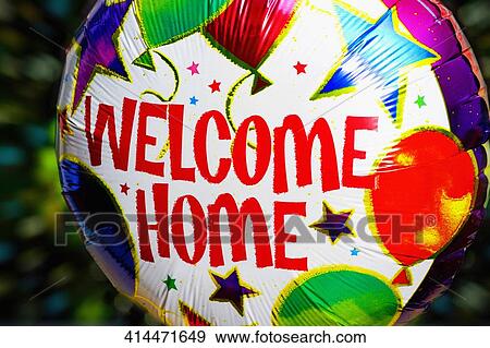 Stock Photo - Close-up of a Welcome sign on a balloon. Fotosearch