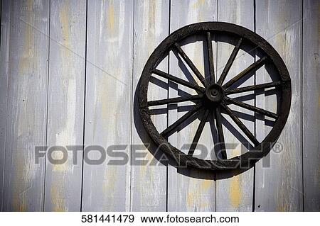 Stock Photo - Close-up of a wheel on a wall. Fotosearch