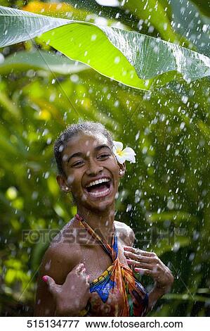 Close-up of a woman enjoying rain shower View Large Photo Image Stock Photo - Close-up of a woman enjoying rain shower. Fotosearch