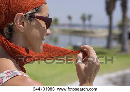 Stock Image - Close-up of a woman smiling. Fotosearch