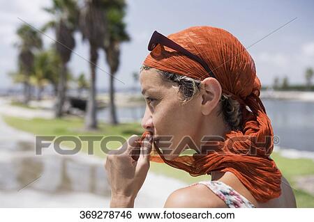 Close-up of a woman thinking View Large Photo Image Stock Photograph - Close-up of a woman thinking. Fotosearch