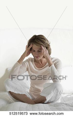 Close-up of a woman with head in hands View Large Photo Image Stock Image - Close-up of a woman with head in hands. Fotosearch