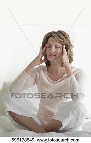 Close-up of a woman with head in hands View Large Photo Image Stock Photo - Close-up of a woman with head in hands. Fotosearch