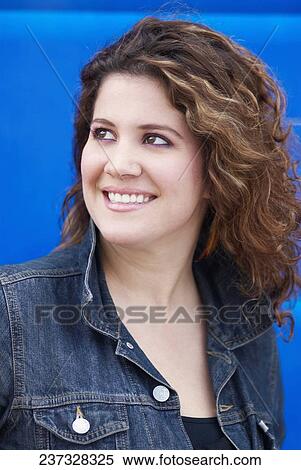 Stock Photography - Close-up of a young woman smiling. Fotosearch