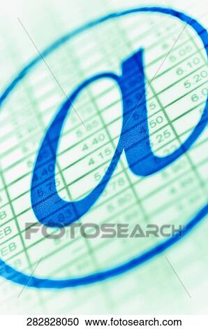 Stock Image - Close-up of at symbol on a visual screen. Fotosearch