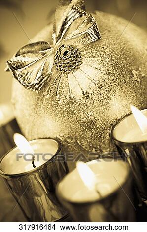Picture - Close-up of candles with a gift. Fotosearch