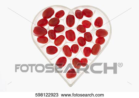 Close-up of cherry tomatoes in a heart shaped tray View Large Photo Image Stock Image - Close-up of cherry tomatoes in a heart shaped tray. Fotosearch