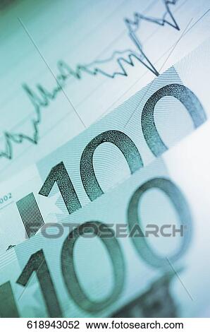 Stock Image - Close-up of European union banknotes and line graph. Fotosearch