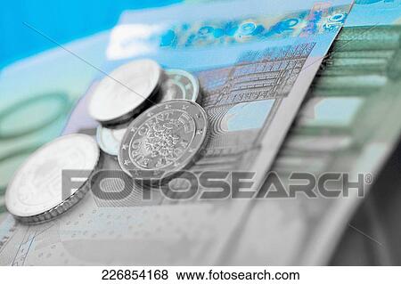 Close-up of European union banknotes with coins View Large Photo Image Stock Photo - Close-up of European union banknotes with coins. Fotosearch