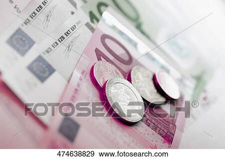 Stock Photo - Close-up of European union banknotes with coins. Fotosearch