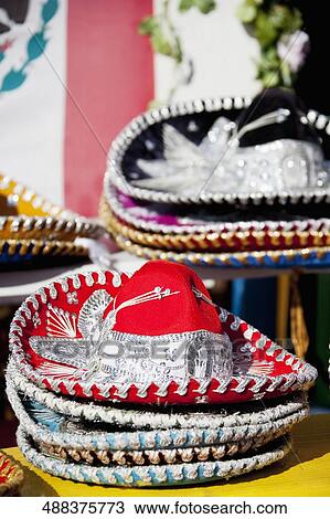Stock Image - Close-up of hats at a market stall, Olvera Street, Los Angeles, California, USA. Fotosearch
