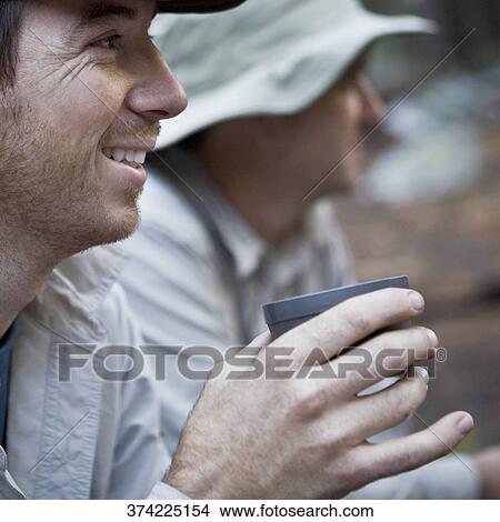 Close-up of hikers drinking tea View Large Photo Image Picture - Close-up of hikers drinking tea. Fotosearch