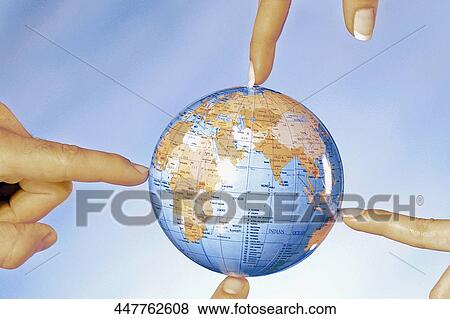 Close-up of human fingers pointing towards a globe View Large Photo Image Stock Photo - Close-up of human fingers pointing towards a globe. Fotosearch