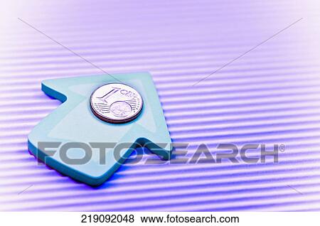 Stock Photo - Close-up of one Euro coin on an upward arrow. Fotosearch
