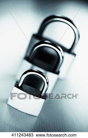 Stock Image - Close-up of padlocks in a row. Fotosearch