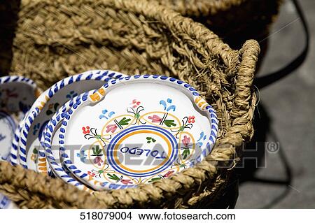 Close-up of plates in a basket View Large Photo Image Picture - Close-up of plates in a basket. Fotosearch
