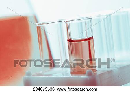 Stock Image - Close-up of test tubes in the test tube holder. Fotosearch