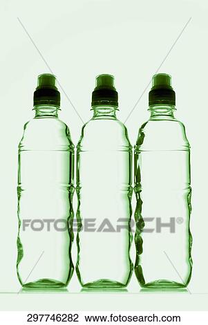 Close-up of three water bottles View Large Photo Image Stock Image - Close-up of three water bottles. Fotosearch