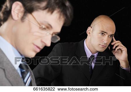 Close-up of two businessmen View Large Photo Image Stock Image - Close-up of two businessmen. Fotosearch