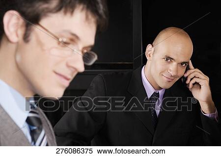 Close-up of two businessmen View Large Photo Image Stock Photography - Close-up of two businessmen. Fotosearch