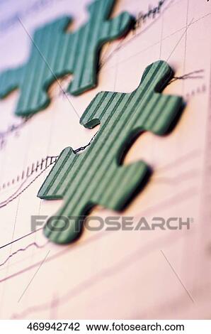 Close-up of two jigsaw pieces on a document View Large Photo Image Stock Image - Close-up of two jigsaw pieces on a document. Fotosearch