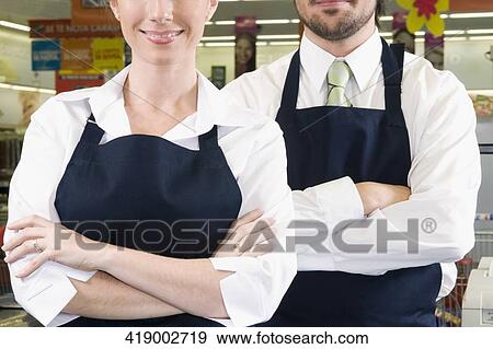 Close-up of two sales representatives View Large Photo Image Stock Photo - Close-up of two sales representatives. Fotosearch