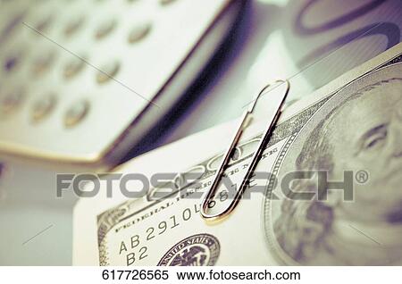 Close-up of US paper currency and a calculator View Large Photo Image Stock Photography - Close-up of US paper currency and a calculator. Fotosearch
