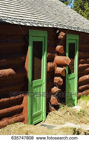 Closed doors of a log cabin View Large Photo Image Stock Photo - Closed doors of a log cabin. Fotosearch