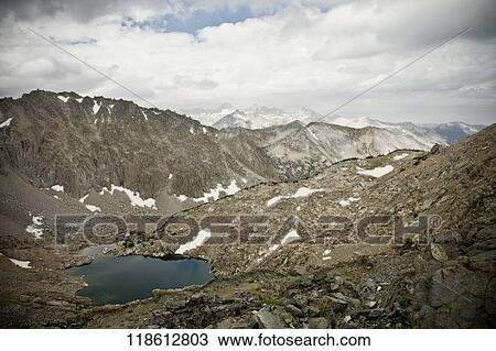 Clouds over a mountain range View Large Photo Image Stock Image - Clouds over a mountain range. Fotosearch