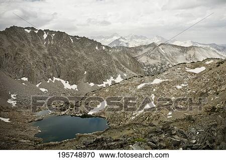 Stock Image - Clouds over a mountain range. Fotosearch