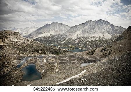 Clouds over a mountain range View Large Photo Image Stock Photography - Clouds over a mountain range. Fotosearch