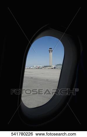 Control tower viewed through an airplane window View Large Photo Image Stock Photograph - Control tower viewed through an airplane window. Fotosearch
