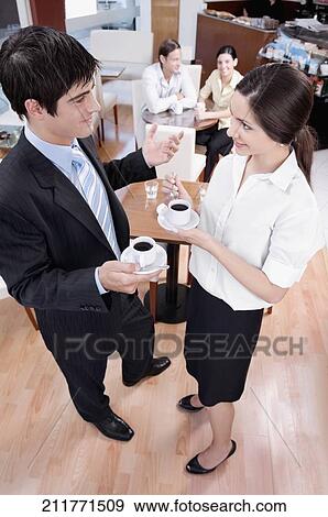 Couple drinking tea in a restaurant View Large Photo Image Stock Photo - Couple drinking tea in a restaurant. Fotosearch