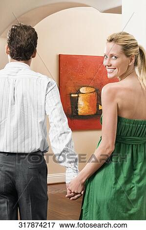 Couple entering in a new house View Large Photo Image Stock Photo - Couple entering in a new house. Fotosearch