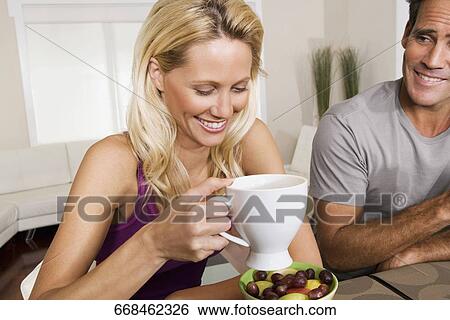 Couple having breakfast View Large Photo Image Stock Photograph - Couple having breakfast. Fotosearch
