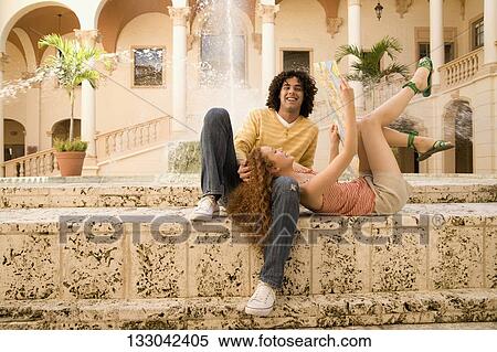 Stock Photography - Couple having fun near a fountain, Biltmore Hotel, Coral Gables, Florida, USA. Fotosearch