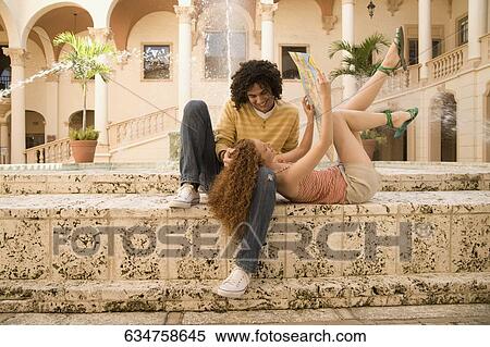 Stock Photography - Couple having fun near a fountain, Biltmore Hotel, Coral Gables, Florida, USA. Fotosearch