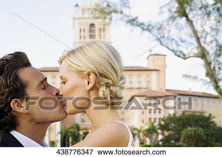 Couple kissing each other, Biltmore Hotel, Biltmore Golf Course, Coral Gables, Florida, USA View Large Photo Image Stock Photo - Couple kissing each other, Biltmore Hotel, Biltmore Golf Course, Coral Gables, Florida, USA. Fotosearch