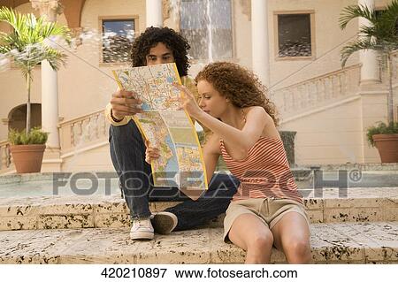 Couple looking at a map, Biltmore Hotel, Coral Gables, Florida, USA View Large Photo Image Stock Photo - Couple looking at a map, Biltmore Hotel, Coral Gables, Florida, USA. Fotosearch
