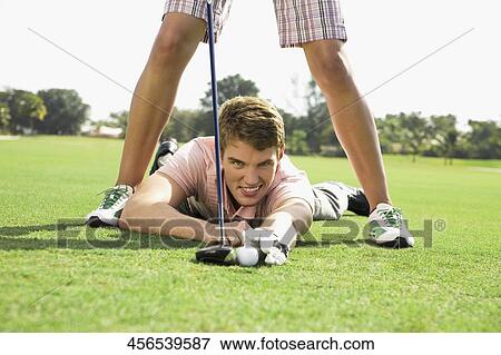 Couple playing golf in a golf course, Biltmore Golf Course, Coral Gables, Florida, USA View Large Photo Image Stock Photo - Couple playing golf in a golf course, Biltmore Golf Course, Coral Gables, Florida, USA. Fotosearch